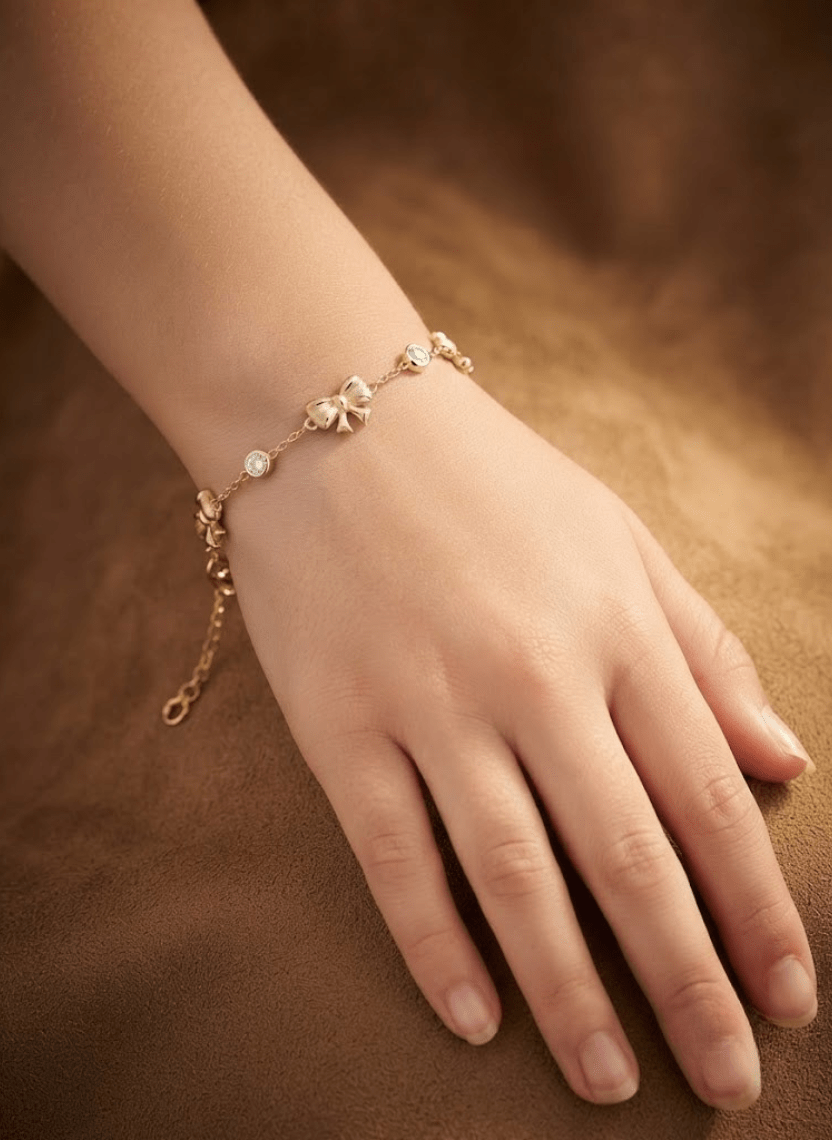 Delicate Gold Bow Charm Bracelet -  - Luxeria